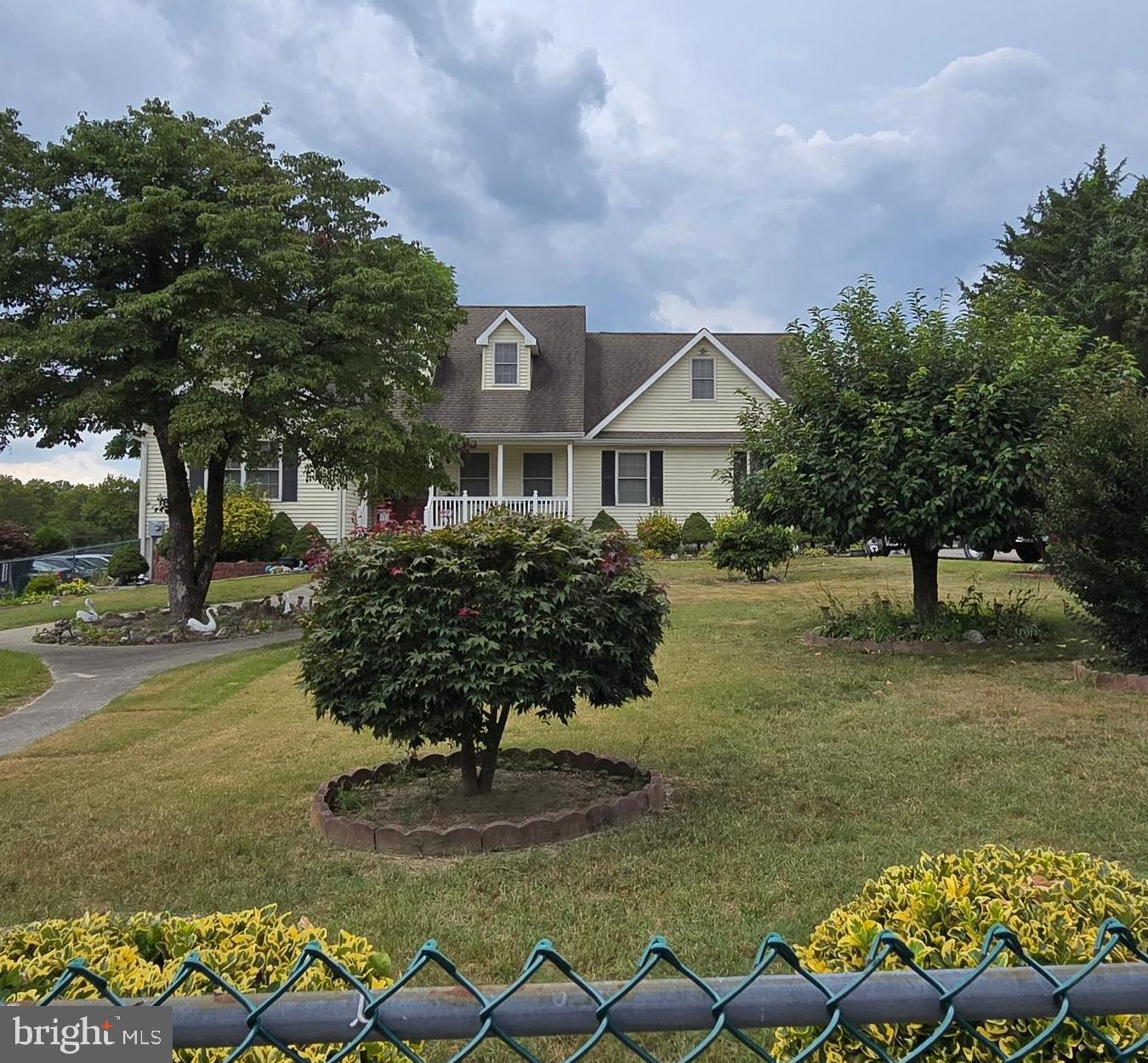 135 Trenton Road Browns Mills, NJ 08015 - Photo 2 of 49 a front view of a house with garden