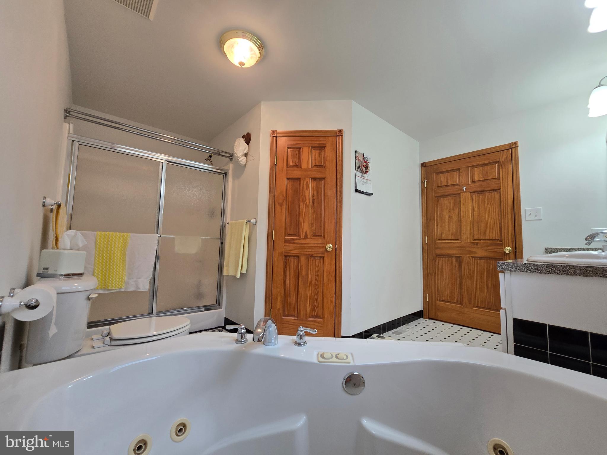 135 Trenton Road Browns Mills, NJ 08015 - Photo 26 of 49 a bathroom with a tub sink and mirror