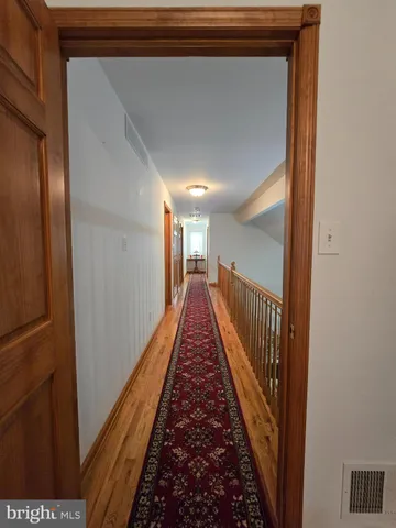 a view of a hallway with a stairs