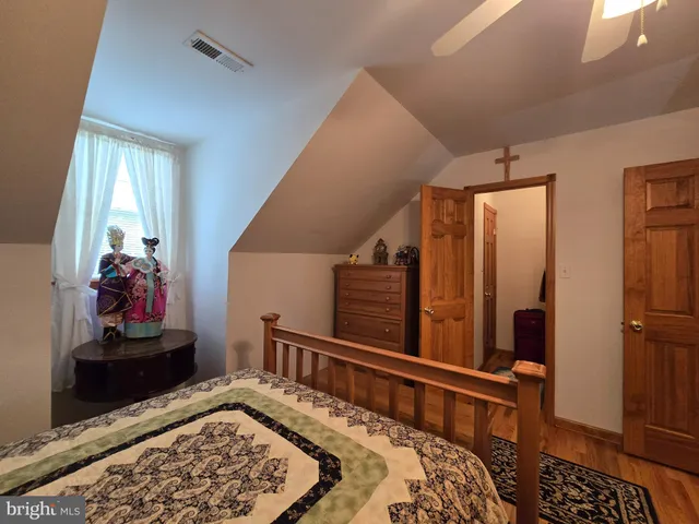 a bedroom with furniture and a window