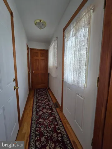 a bathroom with a sink and glass door