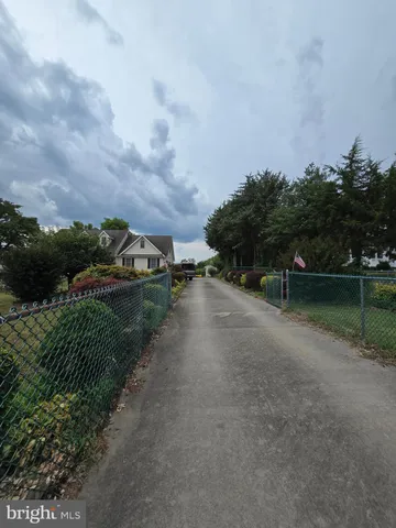 a view of cars parked in front of a house