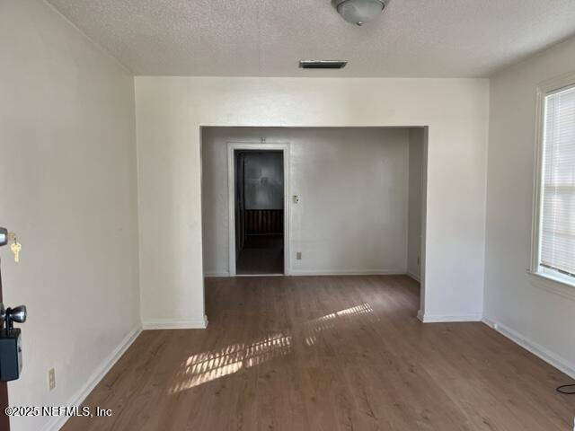 2918 Fitzgerald Street Jacksonville, FL 32254 - Photo 2 of 7 an empty room with windows