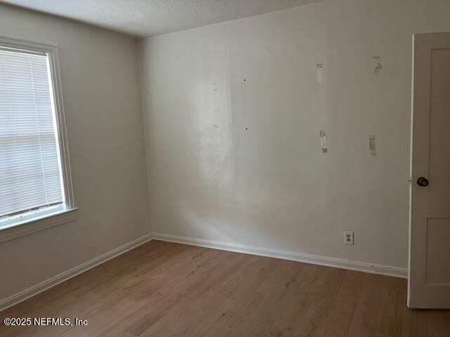 2918 Fitzgerald Street Jacksonville, FL 32254 - Photo 4 of 7 an empty room with a window