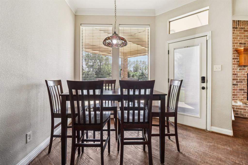 120 Waldrum Road Combine, TX 75159 - Photo 11 of 35 a view of a dining room with furniture wooden floor and chandelier