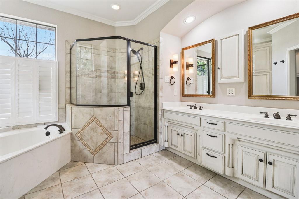 120 Waldrum Road Combine, TX 75159 - Photo 18 of 35 a bathroom with a granite countertop sink a mirror and a bathtub