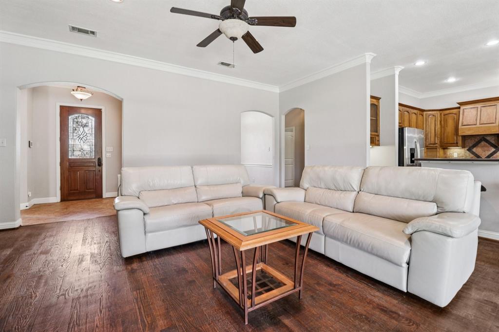 120 Waldrum Road Combine, TX 75159 - Photo 6 of 35 a living room with furniture and a wooden floor