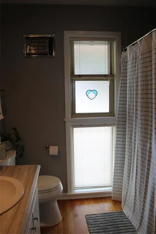 a bathroom with a toilet and a sink