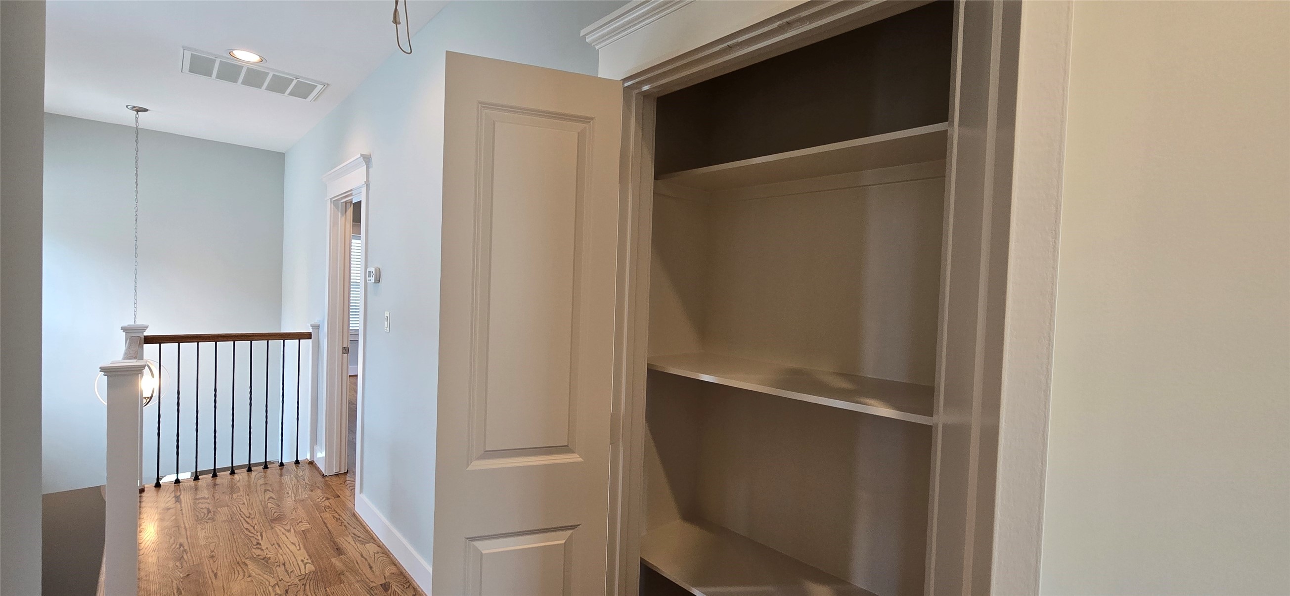 1117 Bonner Street Houston, TX 77007 - Photo 30 of 44 Linen/storage closet in the hallway. Primary bedroom at end of the hall on the right.