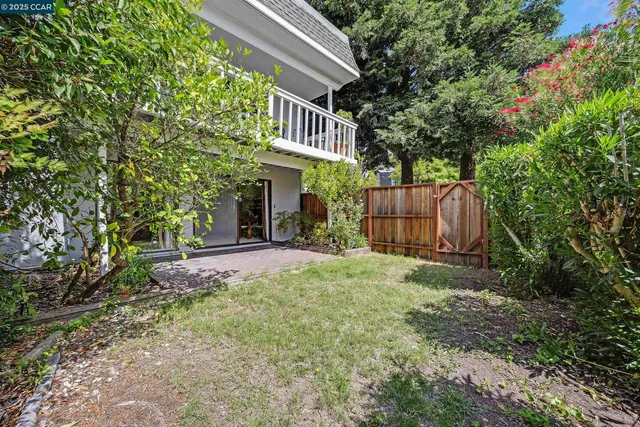 a view of outdoor space with deck and yard