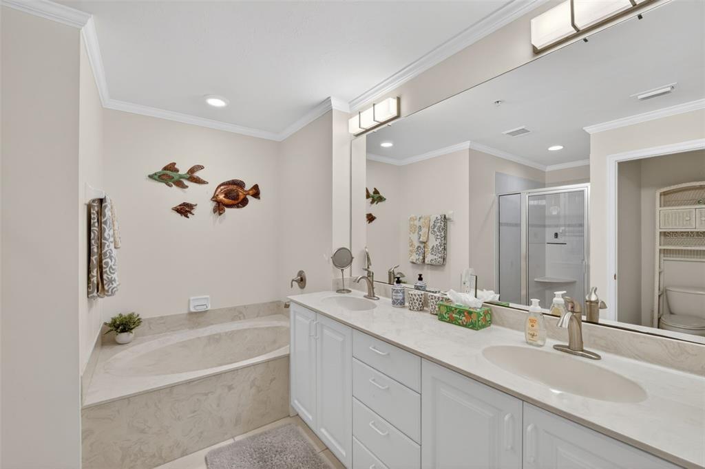 2060 Matecumbe Key Road, Unit 2506 Punta Gorda, FL 33955 - Photo 14 of 38 a bathroom with a double vanity sink and a bathtub