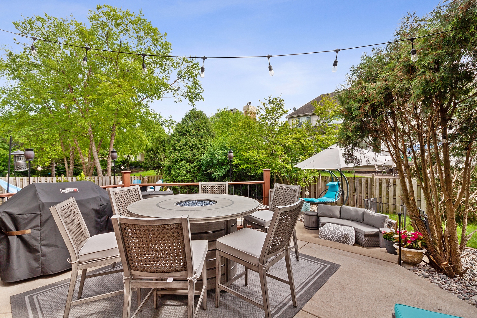 2252 Joyce Lane Naperville, IL 60564 - Photo 27 of 33 a patio with a table and chairs and potted plants