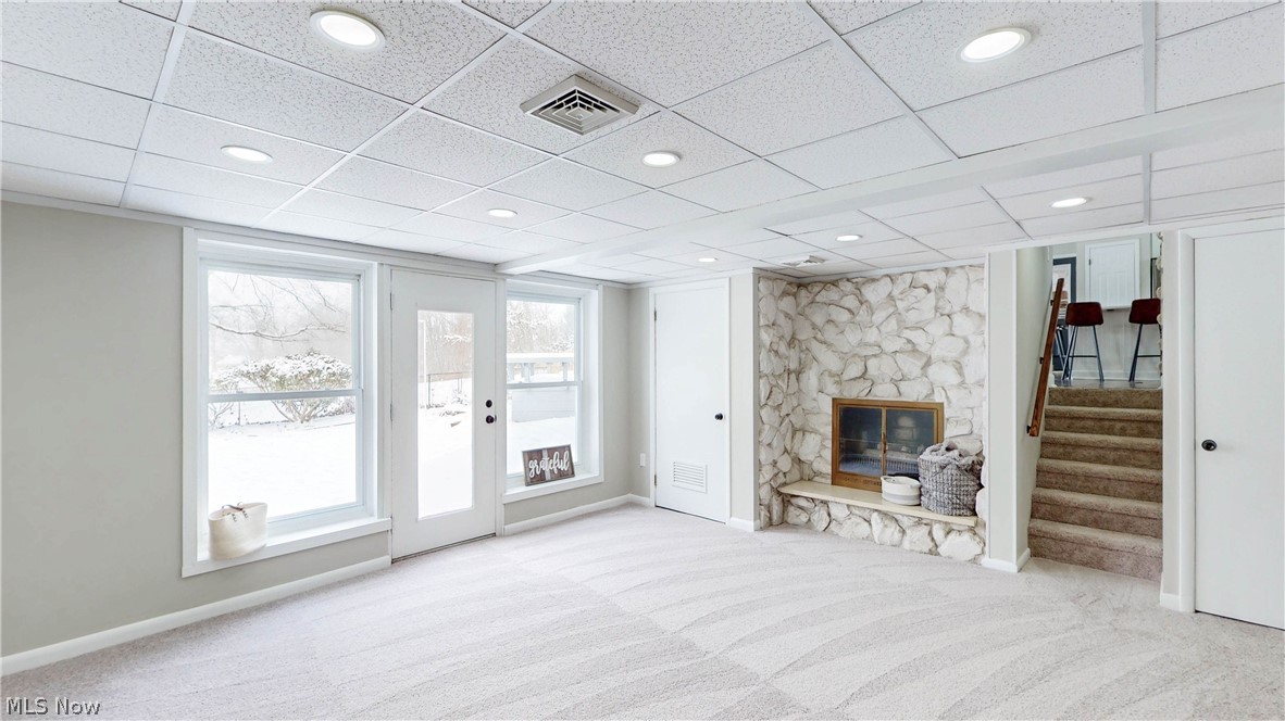3312 Bancroft Road Akron, OH 44333 - Photo 36 of 50 Living room featuring light carpet, a fireplace, a drop ceiling, and recessed lighting
