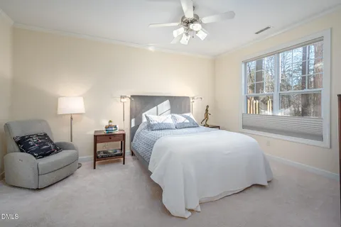 a bedroom with a bed furniture and window