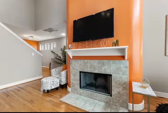a living room with furniture and a flat screen tv