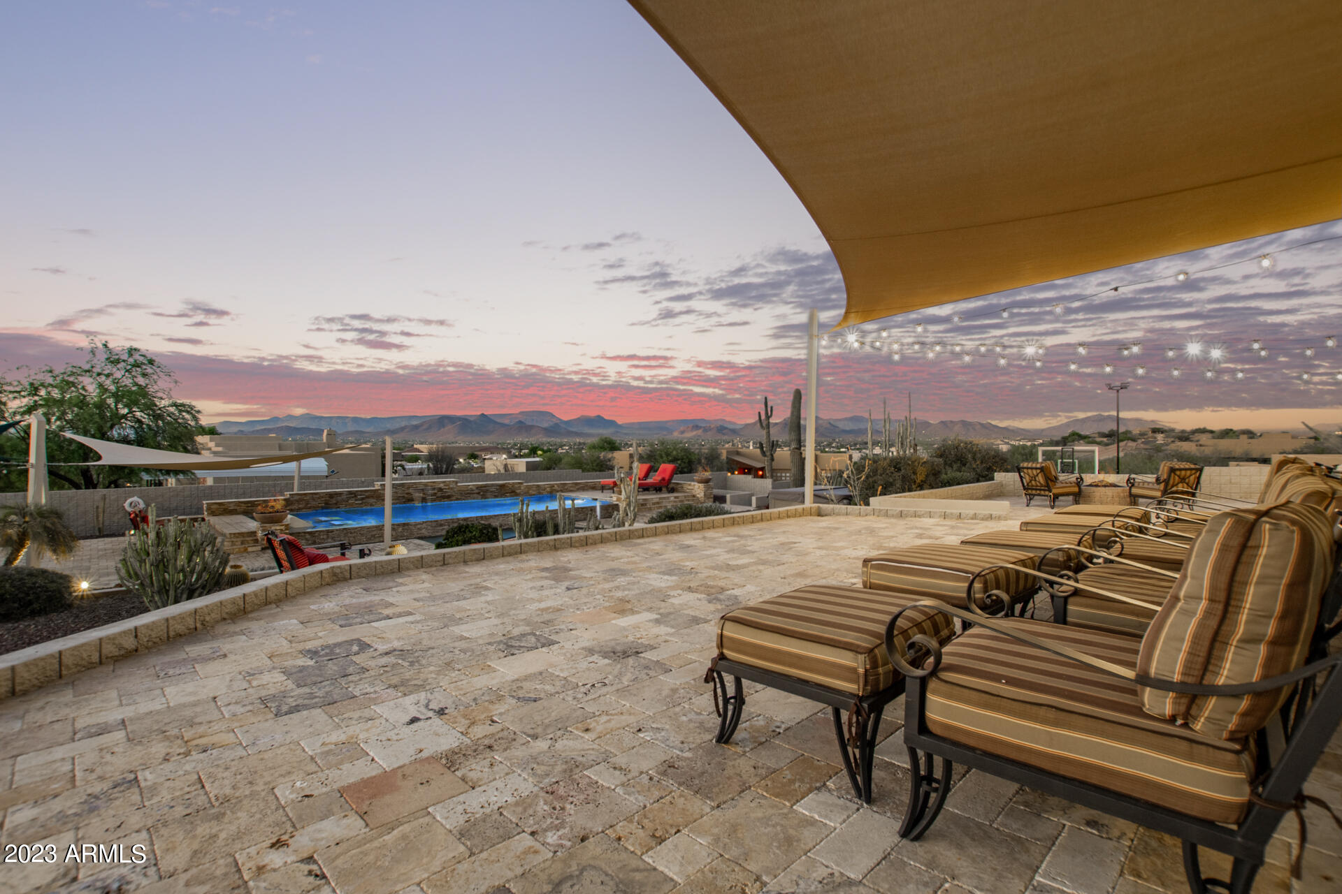 206 West Rock View Road Phoenix, AZ 85085 - Photo 48 of 74 The upper travertine deck