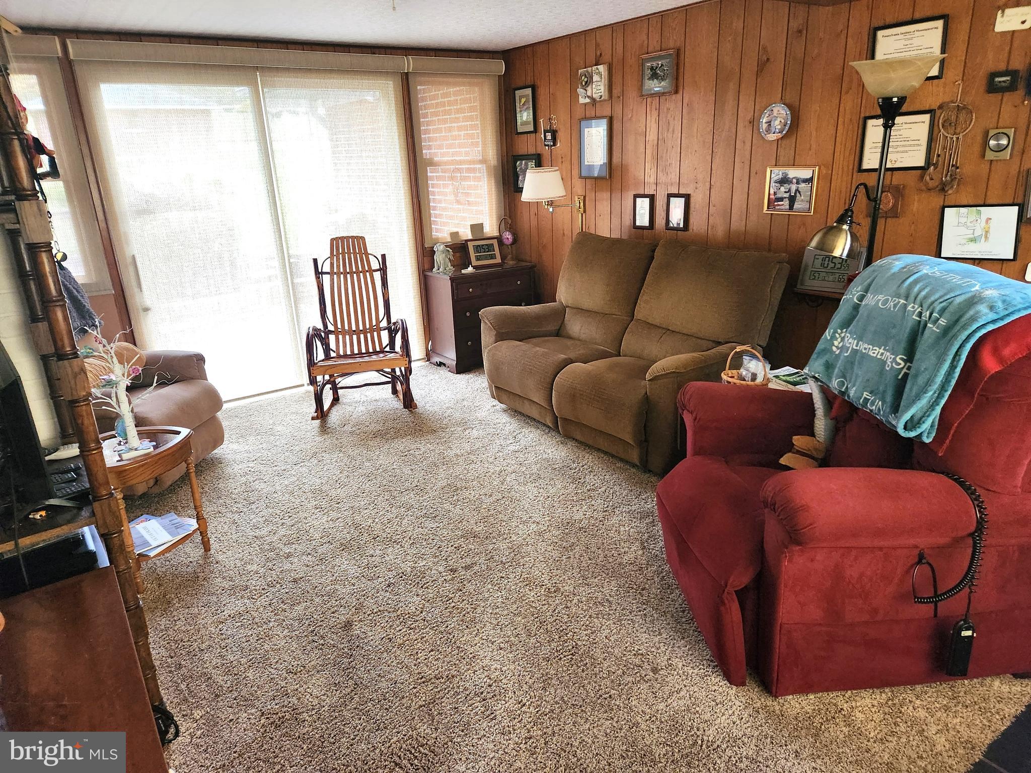 1771 Upper Snake Spring Road Everett, PA 15537 - Photo 13 of 62 Breezeway creates a comfy sitting room space.