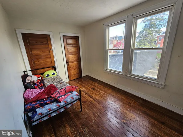 a bedroom with furniture and a window
