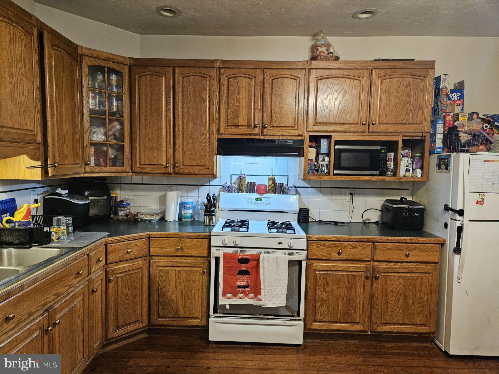 18 North Albemarle Street York, PA 17403 - Photo 7 of 11 a kitchen with stainless steel appliances granite countertop a stove and cabinets
