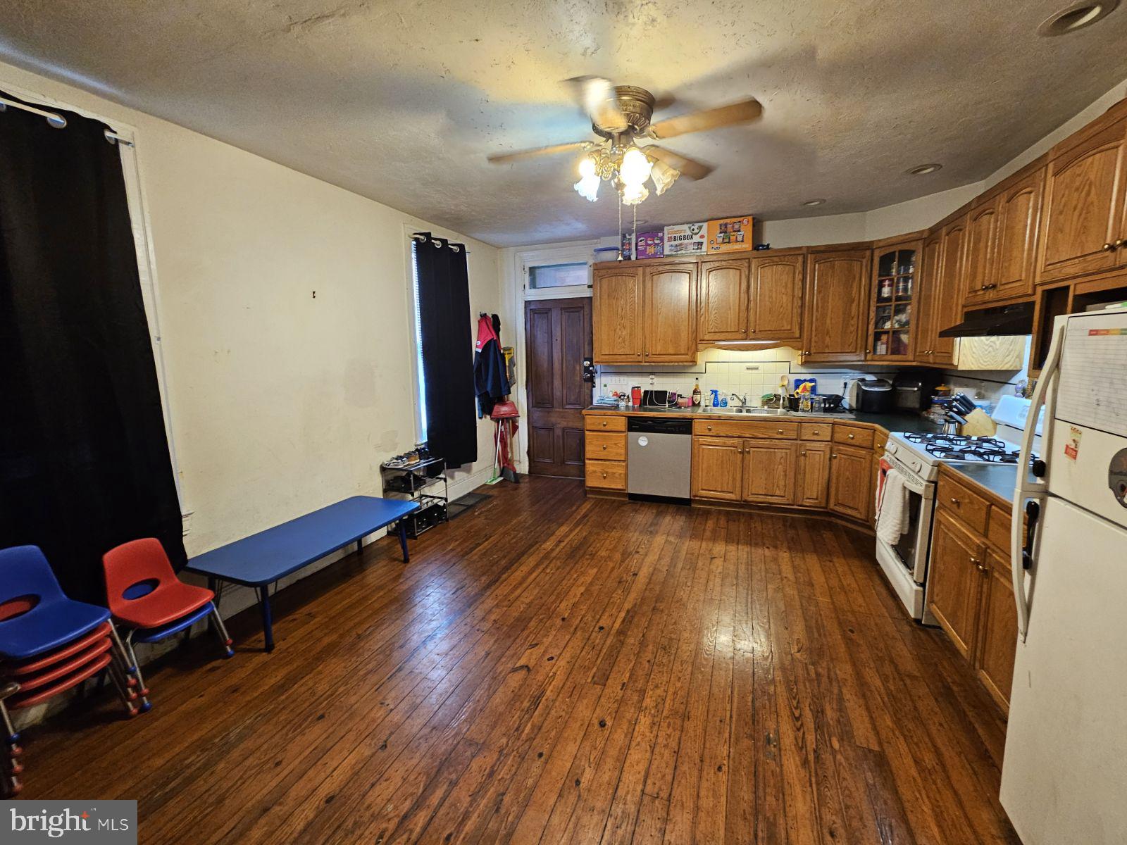 18 North Albemarle Street York, PA 17403 - Photo 8 of 11 a kitchen with stainless steel appliances granite countertop wooden floors stove and sink