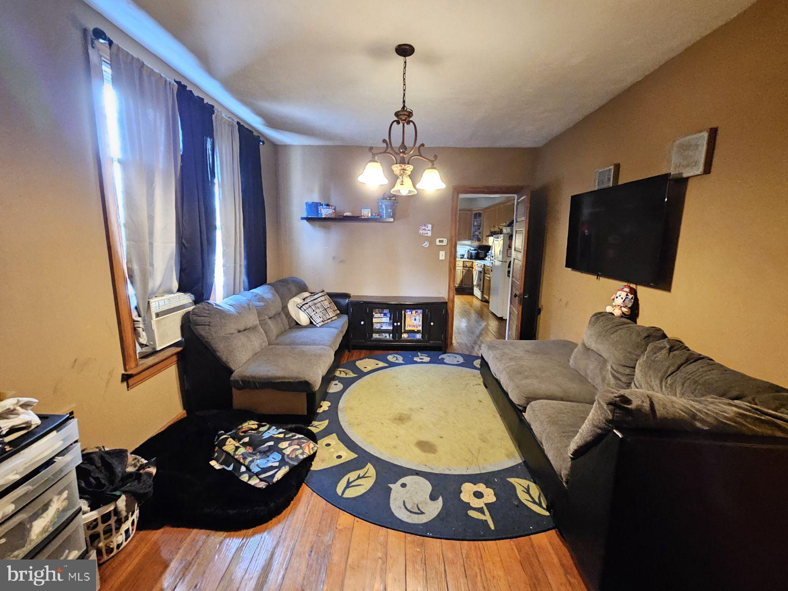 18 North Albemarle Street York, PA 17403 - Photo 9 of 11 a living room with furniture a rug and a flat screen tv