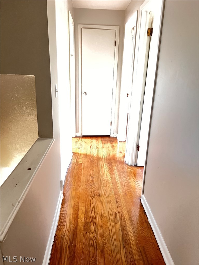 16350 Rockside Road Maple Heights, OH 44137 - Photo 18 of 34 Hardwood flooring extending through the hallway