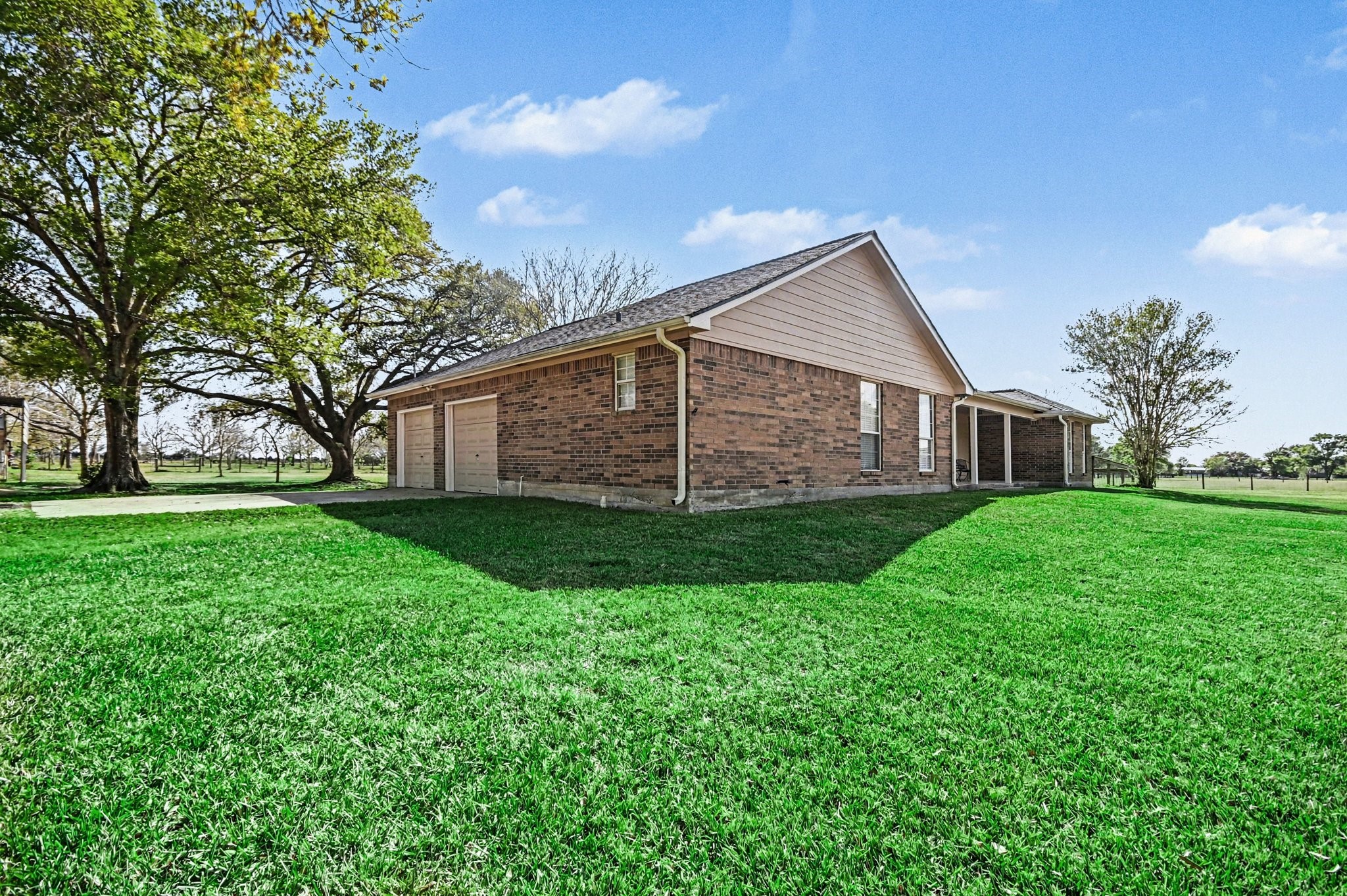 21503 Pecan Bend Road Damon, TX 77430 - Photo 4 of 45 a view of a house with yard and green space