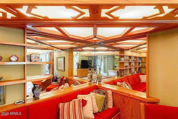 a dining room with furniture and wooden floor