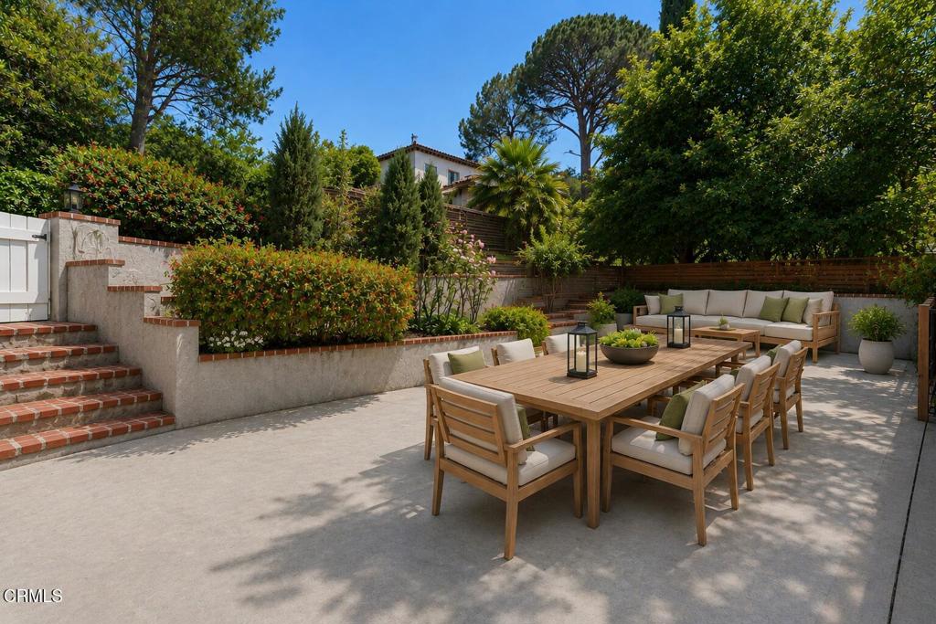 405 Woodcliffe Road Pasadena, CA 91105 - Photo 59 of 65 a view of a patio with table and chairs with wooden fence and plants