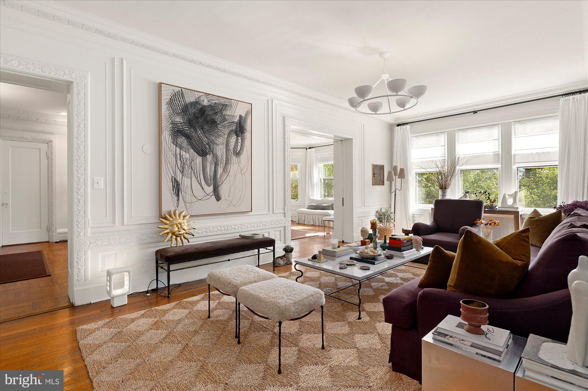 2029 Connecticut Avenue Northwest, Unit 42 Washington, DC 20008 - Photo 14 of 37 a living room with furniture and large windows