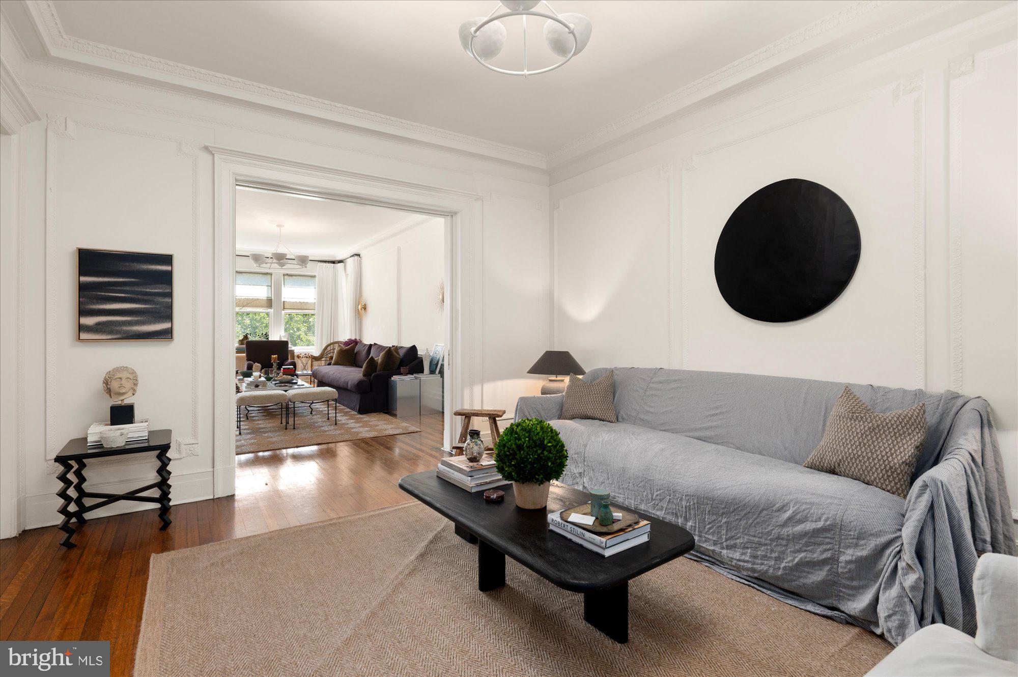 2029 Connecticut Avenue Northwest, Unit 42 Washington, DC 20008 - Photo 17 of 37 a living room with furniture and a large mirror