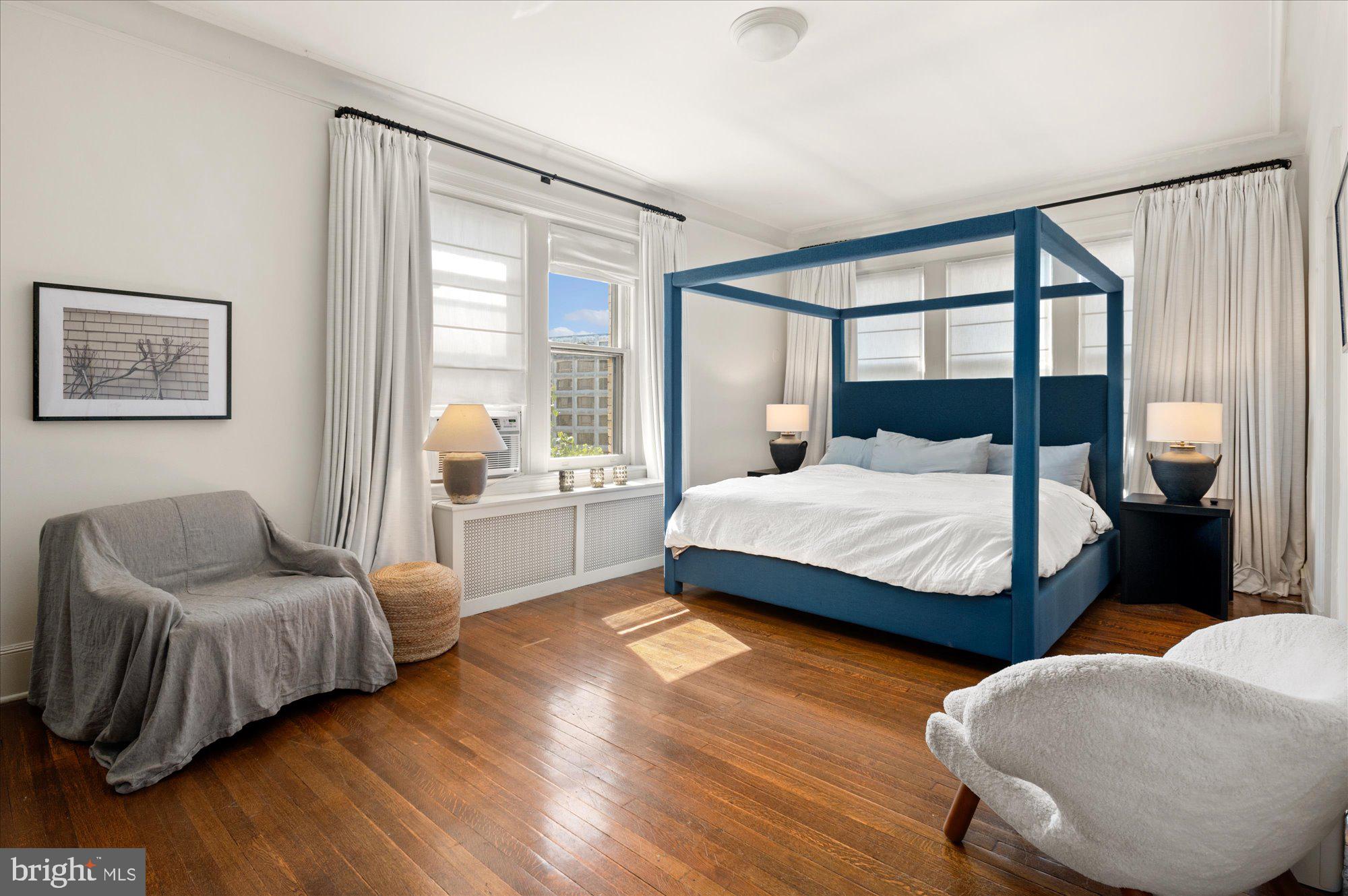 2029 Connecticut Avenue Northwest, Unit 42 Washington, DC 20008 - Photo 23 of 37 a bedroom with a bed and wooden floor