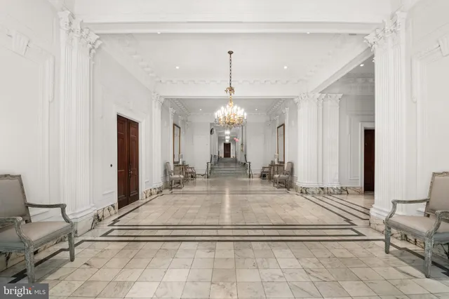a view of a living room and chandelier