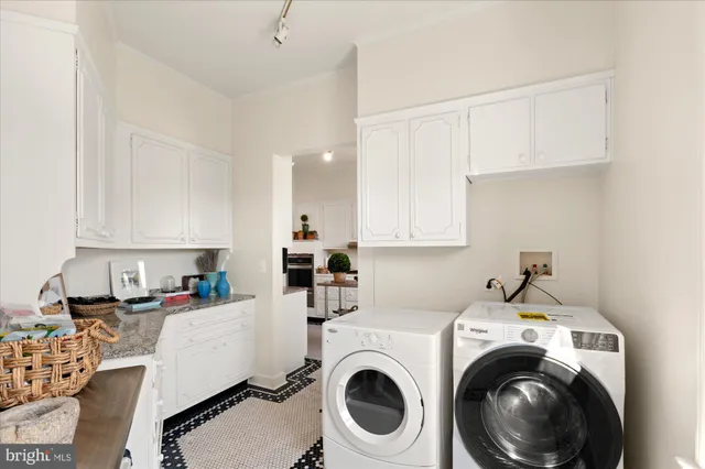a view of kitchen sink and cabinets with wooden floor
