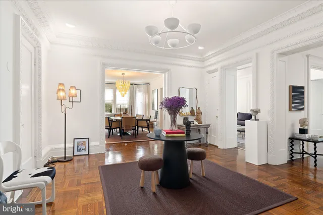 a living room with fireplace furniture and a wooden floor