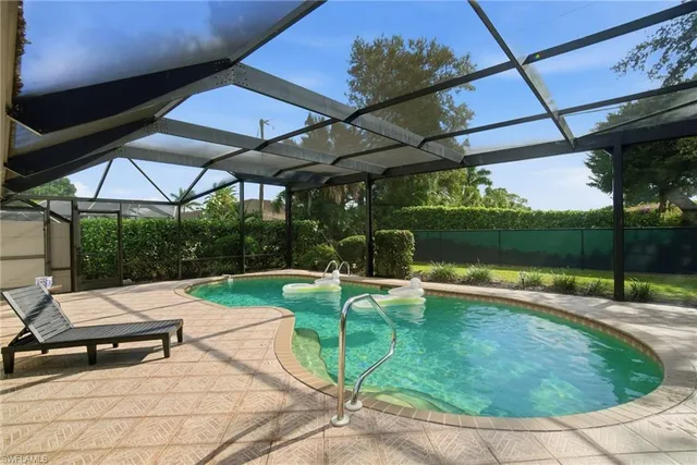 a view of a swimming pool with a patio