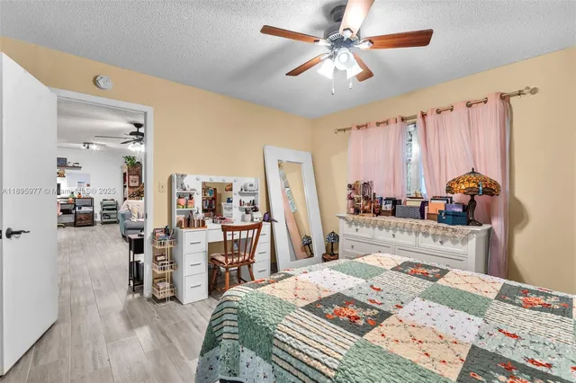 a bedroom with furniture and a bed