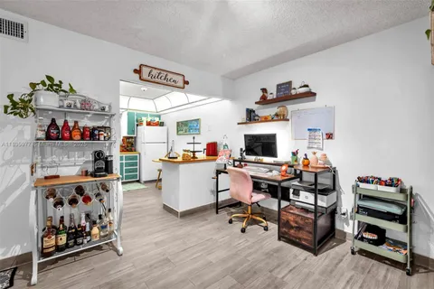 a work room with furniture and wooden floor