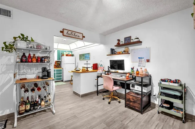 a work room with furniture and wooden floor