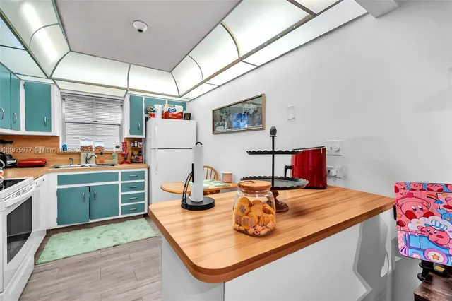 a kitchen with a appliances and cabinets
