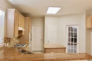 a view of a livingroom with wooden floor and windows
