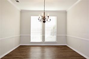 5832 Mossbrook Trail Dallas, TX 75252 - Photo 13 of 20 a view of a room with wooden floor and windows