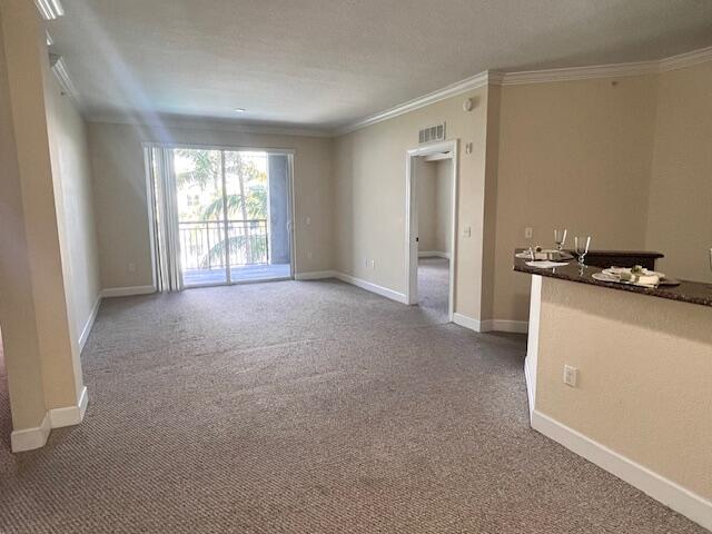 1690 Renaissance Commons Boulevard, Unit 1522 Boynton Beach, FL 33426 - Photo 6 of 31 a view of an empty room with a window
