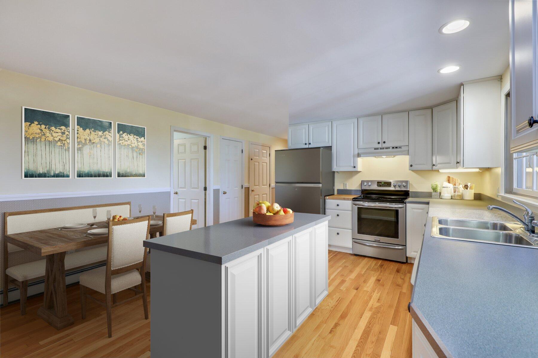 39 Sparrowhawk Road Orleans, MA 02653 - Photo 11 of 40 a kitchen with stainless steel appliances a stove a sink a microwave a refrigerator and cabinets