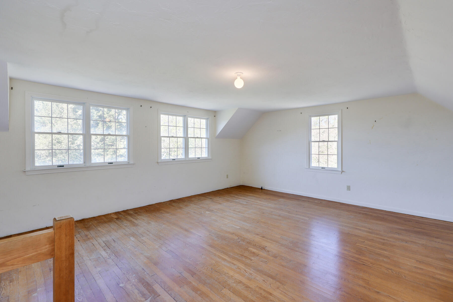 39 Sparrowhawk Road Orleans, MA 02653 - Photo 23 of 40 an empty room with wooden floor and windows