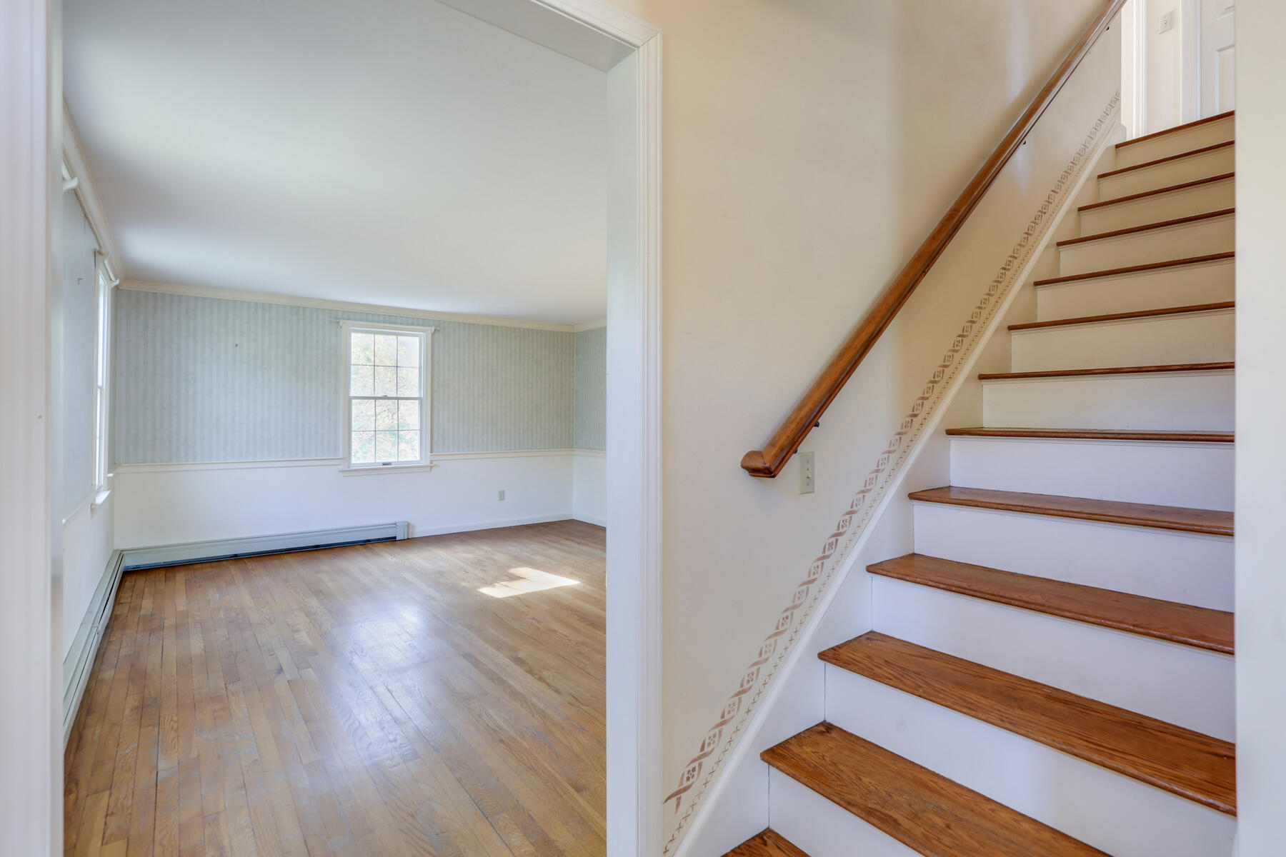 39 Sparrowhawk Road Orleans, MA 02653 - Photo 24 of 40 a view of entryway with wooden floor and stairs