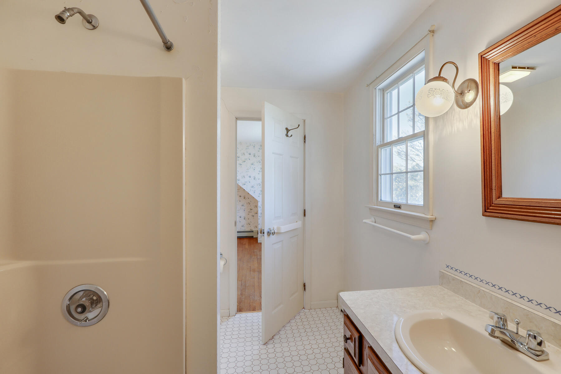 39 Sparrowhawk Road Orleans, MA 02653 - Photo 27 of 40 a bathroom with a sink and a mirror