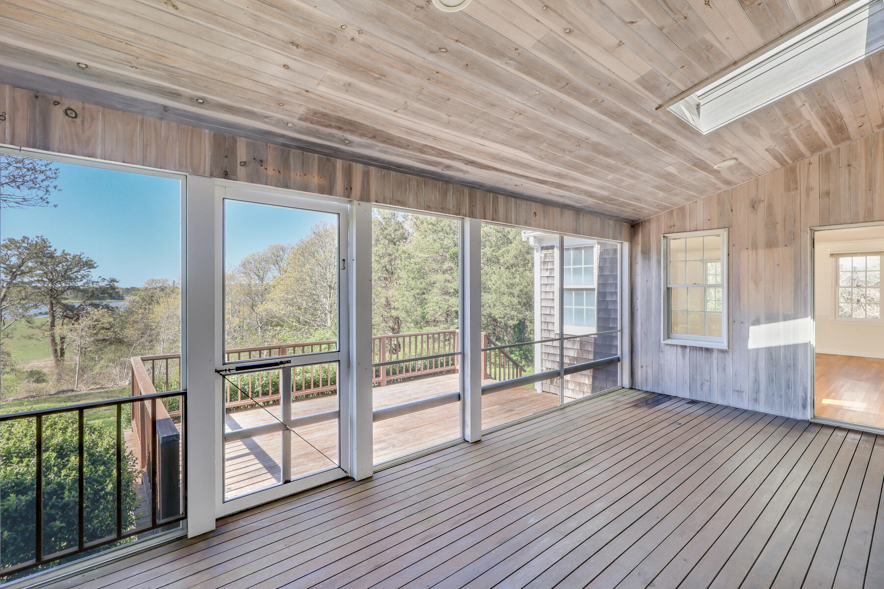 39 Sparrowhawk Road Orleans, MA 02653 - Photo 29 of 40 a view of hallway with wooden floor and large windows