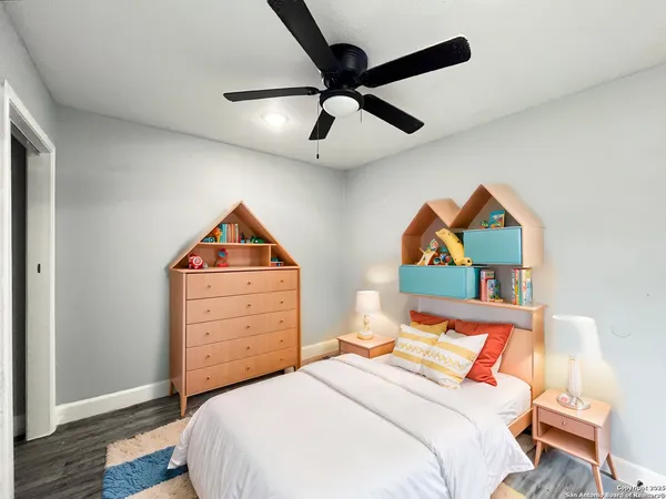 a bedroom with a bed and a dresser