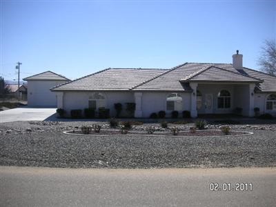 14650 Havasu Road Apple Valley, CA 92307 - Photo 1 of 1 Front of home, showing motorhome garage on the left.